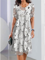 Vestido midi de cuello redondo de malla con estampado floral
